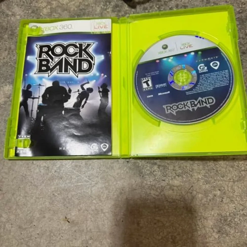Microsoft Xbox 360 S 250 gb Console with Rock Band Guitar and Game